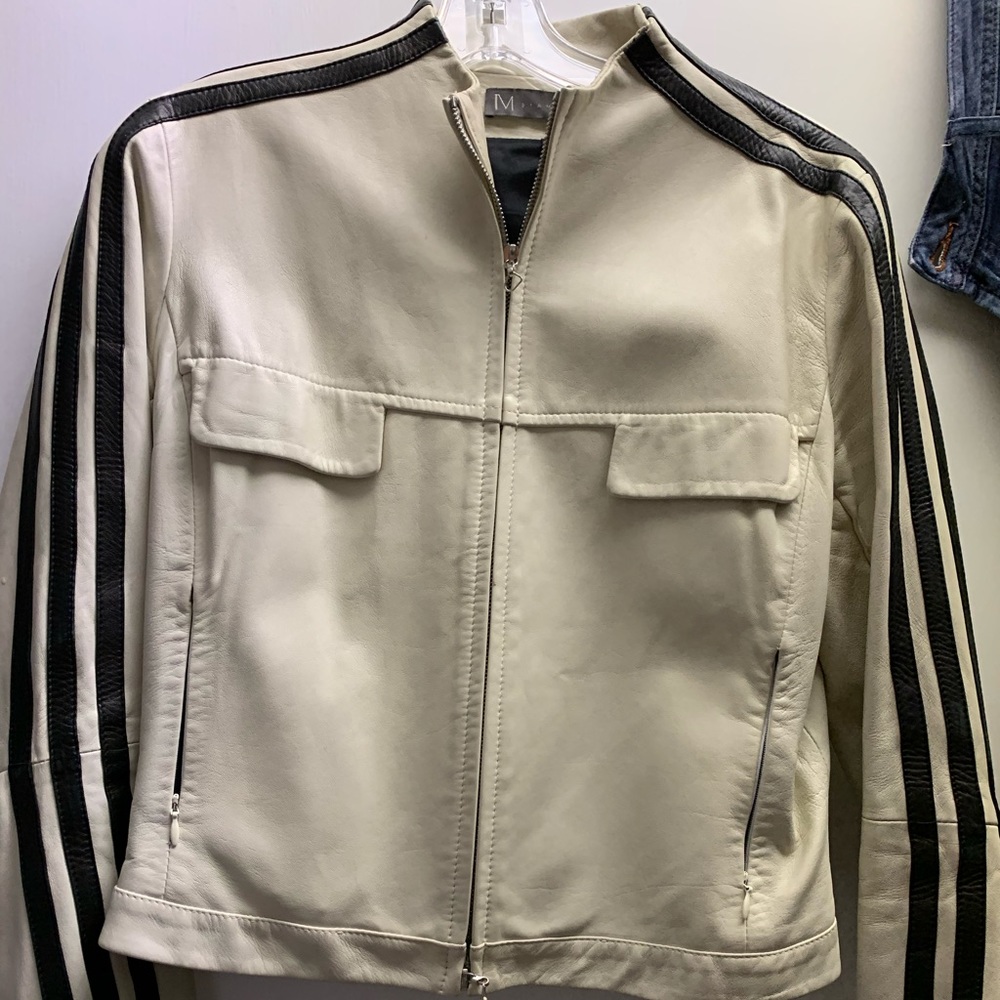 Cream leather jacket with black stripes.